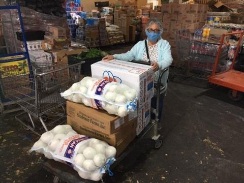 Benedictine Sr. Ursula Herrera, a Benedictine Sister of Boerne, Texas, pictured in an undated photo, buys food to distribute in Piedras Negras, Mexico. (CNS/Courtesy of John Bivens)