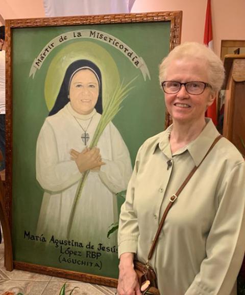 Good Shepherd Sr. Yvette Arnold with a poster of Aguchita (Courtesy of Yvette Arnold)