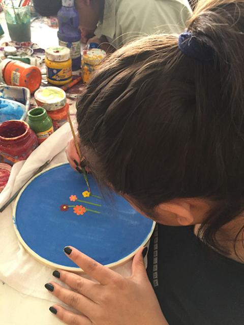 A migrant girl works on an art project at Casa Mambré in the municipality of Iztapalapa in Mexico City in 2022. (Courtesy of Lidia Mara Silva de Souza)