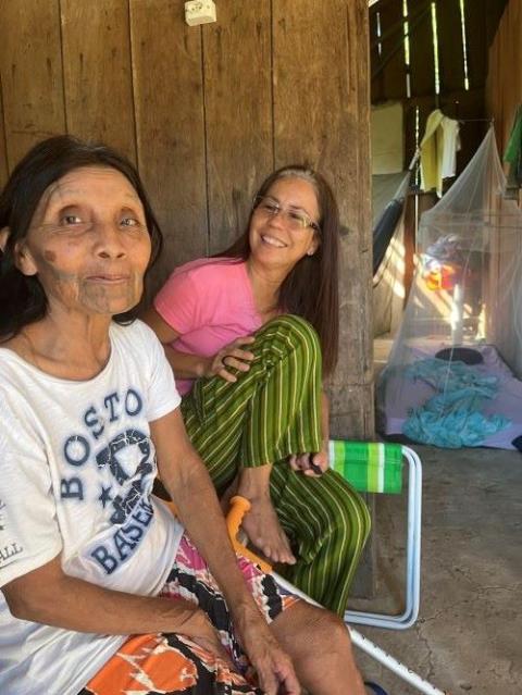 Sr. Laura Vicuña Pereira Manso (back) has accompanied matriarch Katiká and the Karipuna people for more than seven years in defense of their human rights and their care of the Amazon rainforest in Karipuna territory, Brazil. She has been the presence of the Catholic Church in this remote territory where there are no priests. (Ellie Hidalgo)