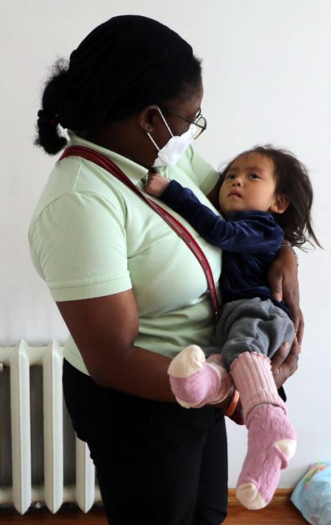 Sr. Lucilla Abemwe Munchi is pictured with the youngest child at the ICM Rainbow Center (Courtesy photo)