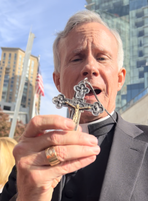 Bishop Joseph Strickland shows his pectoral cross on Nov. 14, 2023. (NCR photo/Brian Fraga)