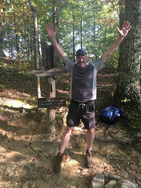 U.S. Sen. Tim Kaine celebrates after reaching the Tennessee border.