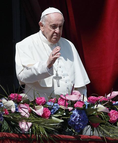 Pope Francis greets the crowd during his Easter message and blessing "urbi et orbi" (to the city and the world) delivered from the central balcony of St. Peter's Basilica at the Vatican April 17, 2022. (CNS/Paul Haring)
