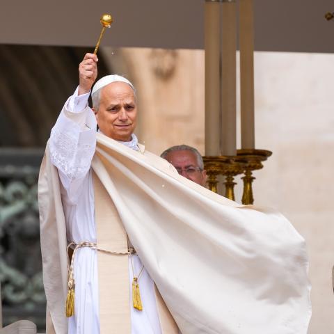 Pope Leo XIV blesses the faithful in St. Peter's Square with holy water at the beginning of his installation Mass at the Vatican May 18, 2025. (CNS photo/Lola Gomez)