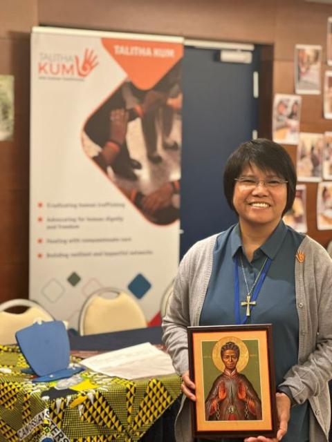 Sr. Abby Avelino holds a photo of St. Josephine Bakhita. Sr. Abby Avelina holds a photo of St. Josephine Bakhita.