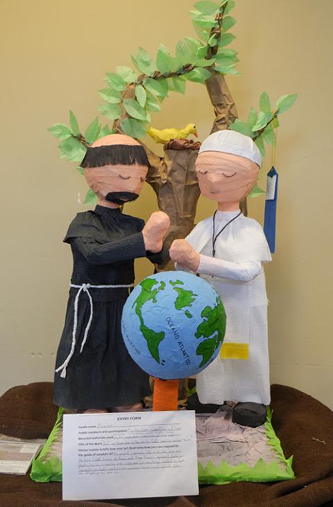 An art project by the Buelos family at St. Leo Catholic School in Versailles, Kentucky, depicts St. Francis of Assisi and Pope Francis praying over the world. (Courtesy of Lexington Diocese)