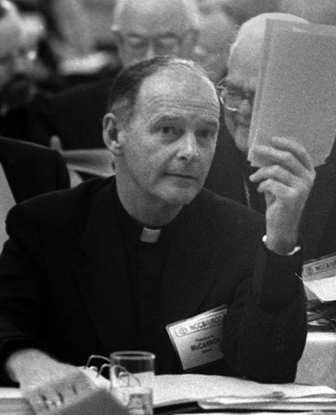 Theodore McCarrick, then archbishop of Newark, N.J., casts a vote during the U.S. bishops' fall meeting in 1986. (CNS file)
