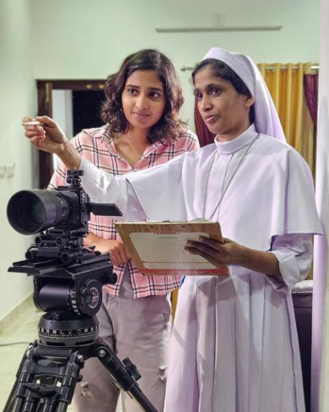 Sr. Seby Thomas with Ann Maria, an actress, at a shooting site in Sultan Bathery, Kerala, India (Courtesy of Seby Thomas)