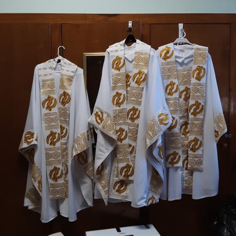 White vestments with gold accents and embroidery made by Sr. Jannette Pruitt