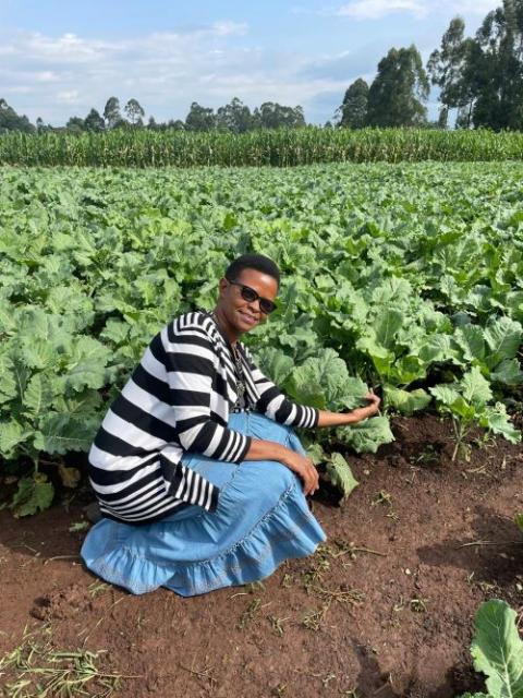 Sr. Flora Nyawira shows Shalom Farm's thriving collard greens. 