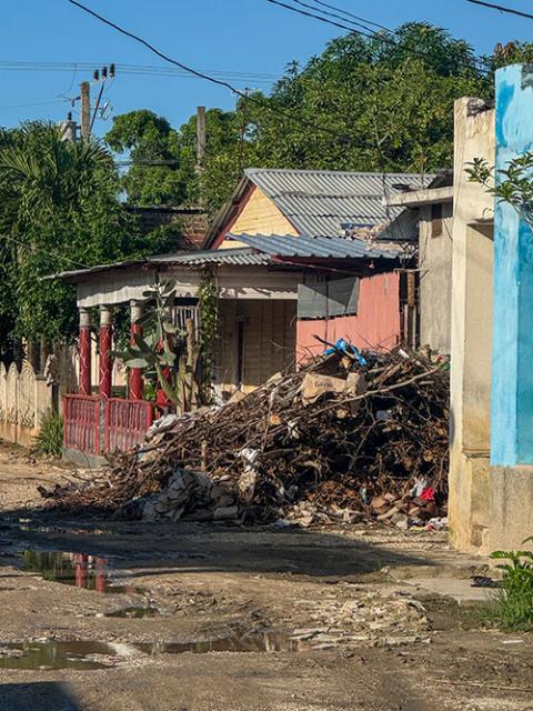 Debris left over from Hurricane Melissa piles up in front of a house in Velasco, Cuba, on the eastern part of the island, Nov. 15, 2025. (NCR photo/Rhina Guidos)
