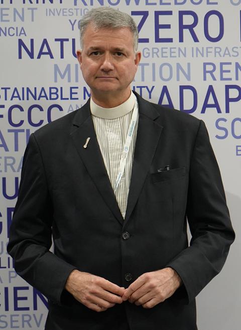 The Rev. Fletcher Harper, Episcopal priest and executive director of GreenFaith, poses for a photo at COP29 in Baku, Azerbaijan, on Nov. 16, 2024. (NCR photo/Doreen Ajiambo)