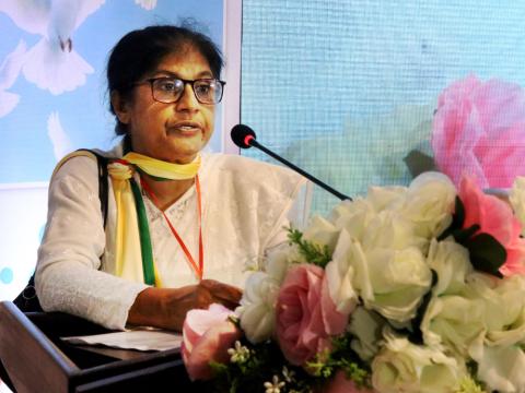Congregation of Our Lady of the Missions Sr. Reba Veronica D'Costa delivers a speech to an interreligious conference in Dhaka. (Stephan Uttom Rozario)