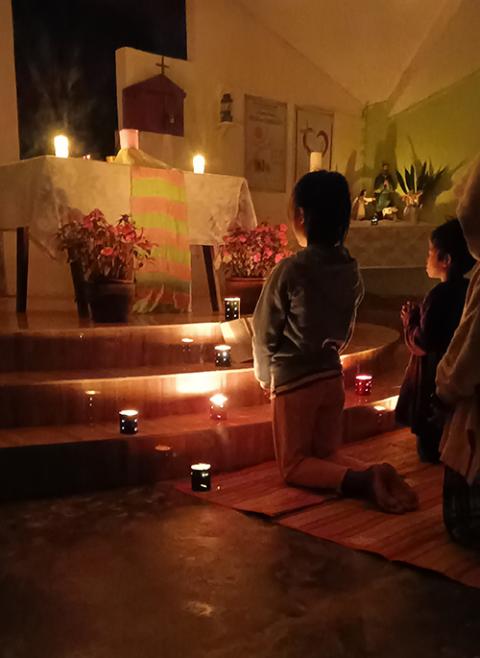 The children and youth pray during the Pentecost vigil. (Marjorie Guingona)