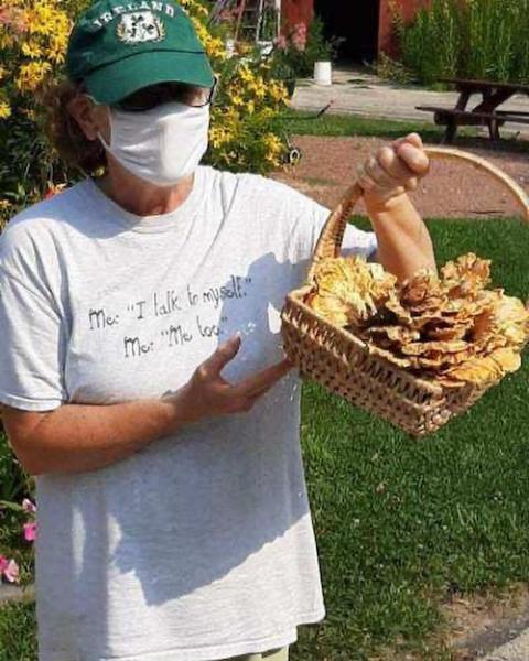 Dominican Volunteer Maureen Geglio shows off "hen of the woods" mushrooms, locally grown at her ministry site, the Eco-Justice Center, in Racine, Wisconsin in September 2020. (Provided photo)