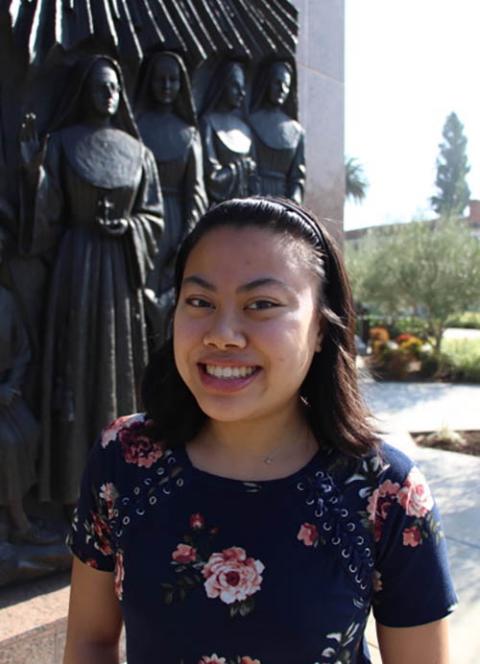 Me with my freshly cut hair in front of the Statue of the Valiant Women, showing foundress Mother Bernard Gosselin and the pioneering Sisters of St. Joseph of Orange (Courtesy of the Sisters of St. Joseph of Orange)