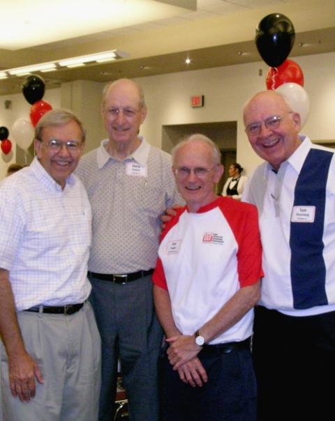 The founding priests of Iowa Citizens for Community Improvement pose for a photo at the group's 30th anniversary convention in 2005. From left: former priest Vince Hatt, Fr. Gene Kutsch, former priest Joe Fagan, and Fr. Tom Rhomberg. (Courtesy of Iowa CCI The founding priests of Iowa Citizens for Community Improvement pose for a photo at the group's 30th anniversary convention in 2005. From left: former priest Vince Hatt, Fr. Gene Kutsch, former priest Joe Fagan, and Fr. Tom Rhomberg. (Courtesy of Iowa CCI