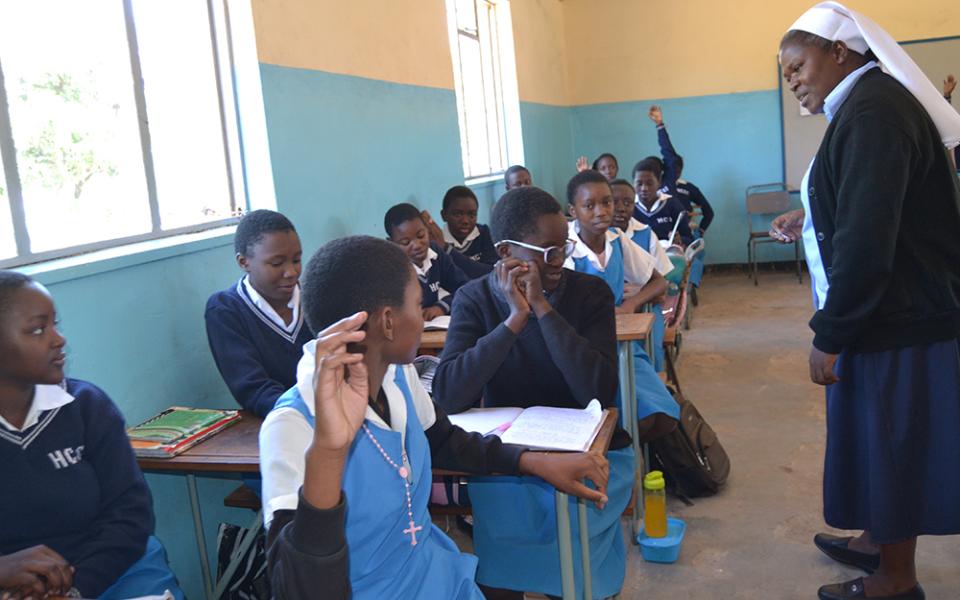 Sr. Bibian Mbao engages her grade eight students at Holy Cross Girls Secondary School in Mongu, Zambia. (Derrick Silimina)