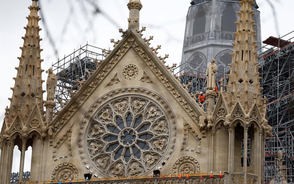 Construction workers are seen on scaffolding at the Notre Dame Cathedral in Paris Dec. 3, 2024, which was ravaged by a fire in 2019, as restoration works continue before its planned reopening ceremonies Dec. 7 and 8. (OSV News/Reuters/Stephanie Lecocq)