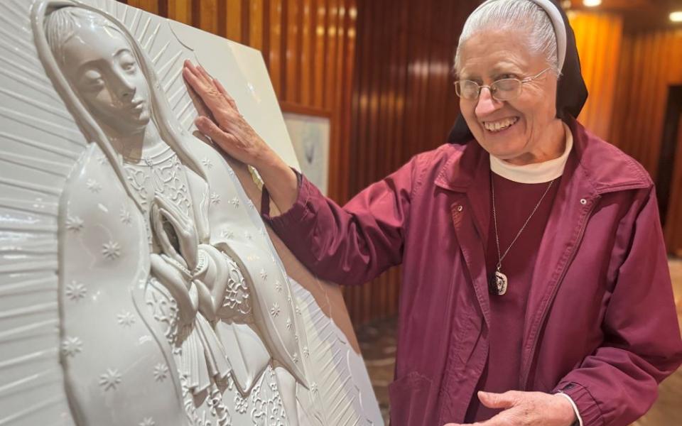 Sr. María Celina Mota Campos moves toward a sculpture for the blind at the Basilica of Our Lady of Guadalupe in Mexico City Nov. 6.