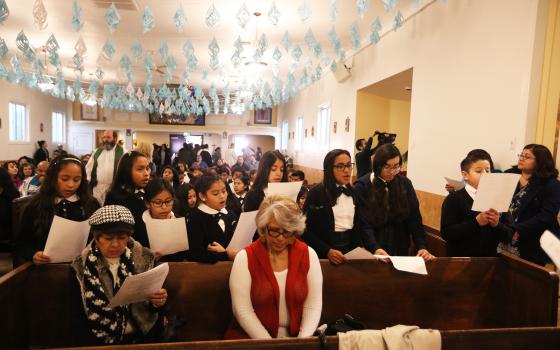 Families attend Mass Jan. 11, 2017, at Dolores Mission Church in Los Angeles. (Angelus News /Los Angeles Archdiocese/Victor Aleman)