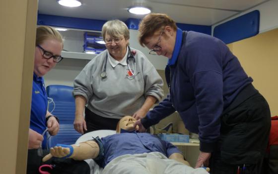 Paramedic students Destiny Hatfield, left, and Lyn Garison, right, work through a simulated emergency medical scenario as teacher Sr. Kathy Limber looks on at Southwest Virginia Community College in Cedar Bluff. (Provided photo)