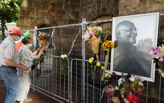 Mourners pay their respects to the late Anglican Archbishop Desmond Tutu outside St. George's Anglican Cathedral in Cape Town, South Africa. (CNS/Reuters/Mike Hutchings)