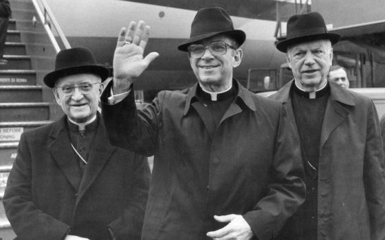 Cardinal Joseph L. Bernardin, archbishop of Chicago, waves upon arriving at Rome's Leonardo Da Vinci airport in this Jan. 30, 1983, file photo. In December 1983 he delivered a lecture outlining a "consistent ethic of life." (AP/Massimo Sambucetti)