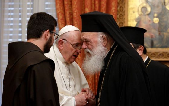 Pope Francis talks with Orthodox Archbishop Ieronymos II of Athens and all Greece during a meeting with their delegations in the Throne Room of the archbishopric in Athens, Greece, Dec. 4, 2021. (CNS photo/Paul Haring)