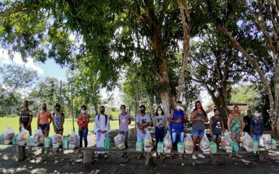 Members of the Comboni Missionary community in Brazil prepare to share food baskets during the COVID-19 pandemic. (Caterina Ingelido)