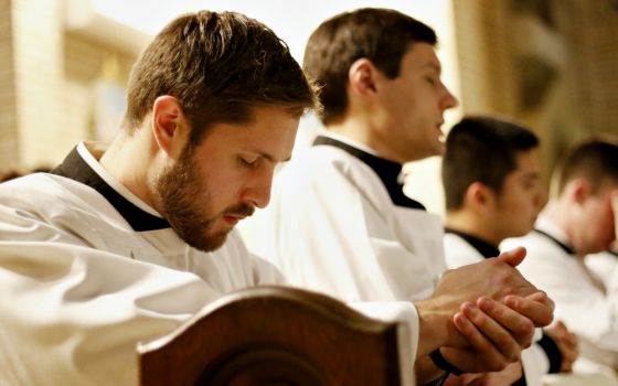 Seminarians pray during a Holy Hour for vocations Jan. 20 at St. Patrick Church in Bay Shore, New York. The service was sponsored by the vocations office of the Rockville Centre Diocese. (CNS/Long Island Catholic/Gregory A. Shemitz)