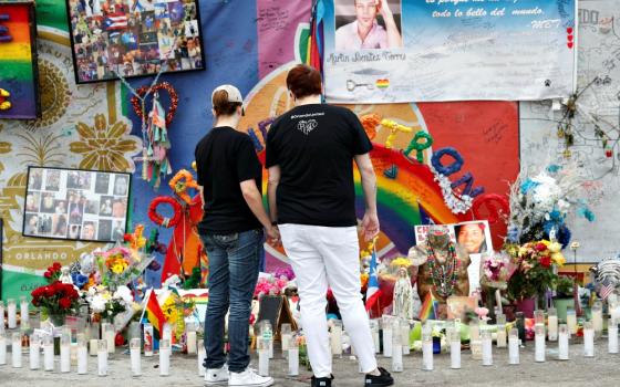 People visit the memorial outside the Pulse nightclub in Orlando, Florida, June 12, 2017, the one-year anniversary of the mass shooting there. (CNS/Reuters/Scott Audette)