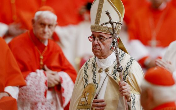 Pope Francis walks past cardinals as he leaves a consistory in St. Peter's Basilica at the Vatican June 28, 2017. (CNS/Paul Haring)