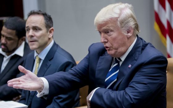 President Donald Trump gestures during a meeting on immigration with a bipartisan group of House and Senate members at the White House Jan. 9. (CNS/EPA/Shawn Thew)