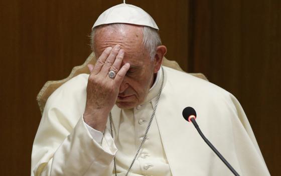 Pope Francis gestures before speaking about the death penalty at an event marking the 25th anniversary of the Catechism of the Catholic Church, at the Vatican in this Oct. 11, 2017, file photo. The pope ordered a revision to the catechism to state that th