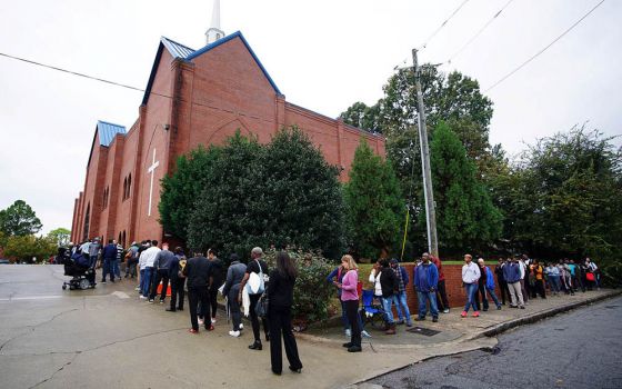 A line of voters wraps around Our Lady of Lourdes Catholic Church in Atlanta during midterm elections Nov. 6, 2018. (CNS/Reuters/Lawrence Bryant)