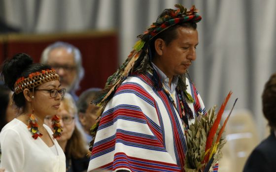 Indigenous people carry offertory gifts as Pope Francis celebrates the concluding Mass of the Synod of Bishops for the Amazon at the Vatican Oct. 27, 2019. (CNS/Paul Haring)