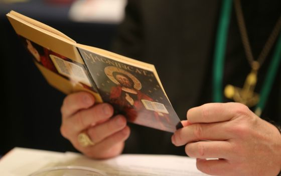 A bishop attends morning prayer at the fall general assembly of the U.S. Conference of Catholic Bishops Nov. 12 in Baltimore. (CNS/Bob Roller) 