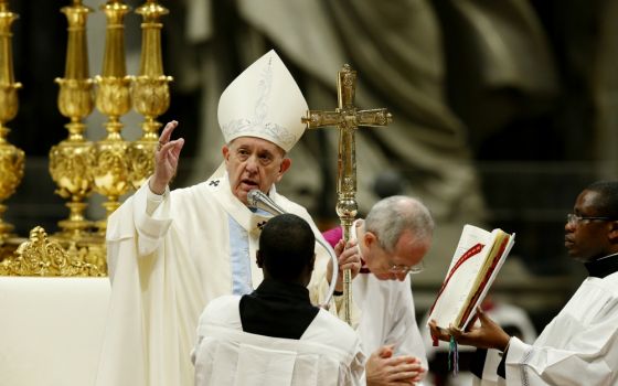 Pope Francis delivers his blessing as he celebrates Mass on the feast of Mary, Mother of God, in St. Peter’s Basilica at the Vatican Jan. 1. (CNS/Paul Haring)