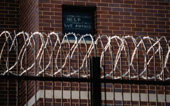 Signs made by Cook County Jail prisoners in Chicago plead for help April 7 during the coronavirus pandemic. (CNS/Reuters/Jim Vondruska)