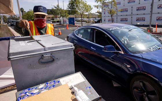 Residents of San Diego drive up to drop off their mail-in ballots at the offices of the Registrar of Voters for San Diego County Oct. 19. (CNS/Reuters/Mike Blake)