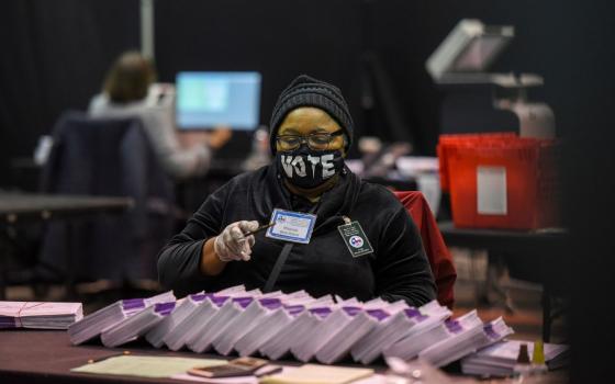 An election worker in Houston, Texas, processes mail-in ballots Nov. 2.