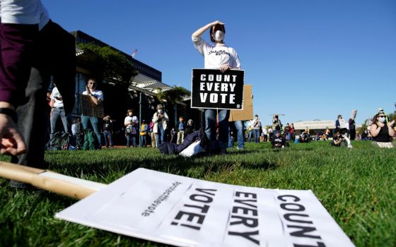 A woman holds a sign during a rally demanding a fair count of the votes of the presidential election in Philadelphia Nov. 4. (CNS/Reuters/Eduardo Munoz)