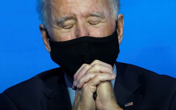 President-elect Joe Biden takes a moment for prayer at his transition headquarters Dec. 8 in Wilmington, Delaware. (CNS/Kevin Lamarque, Reuters)