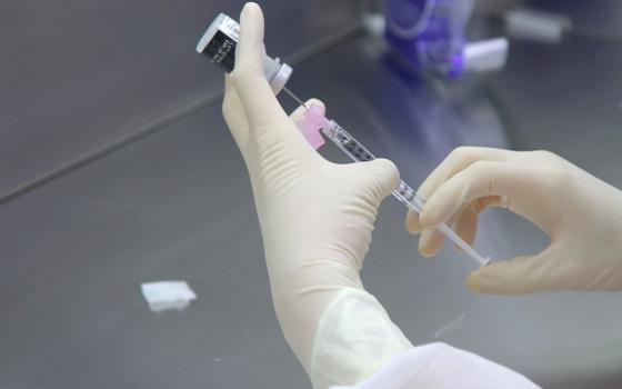 A pharmacist undergoes training in preparation for the distribution of the Pfizer coronavirus vaccine at a Mount Sinai Health System pharmacy in the Queens borough of New York City in this handout photo released Dec. 10. (CNS/Mount Sinai Health System via