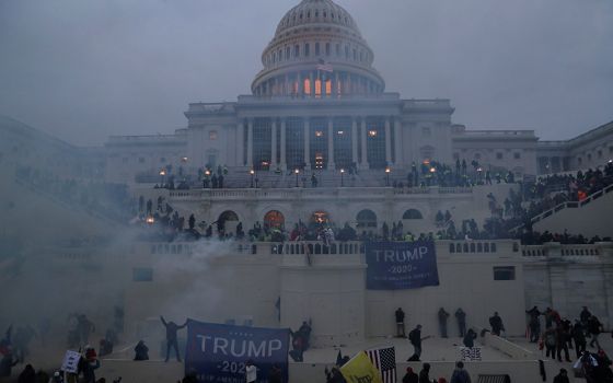 Police officers in Washington stand guard Jan. 6, 2021, as supporters of President Donald Trump gather in front of the U.S. Capitol. (CNS/Leah Millis, Reuters)