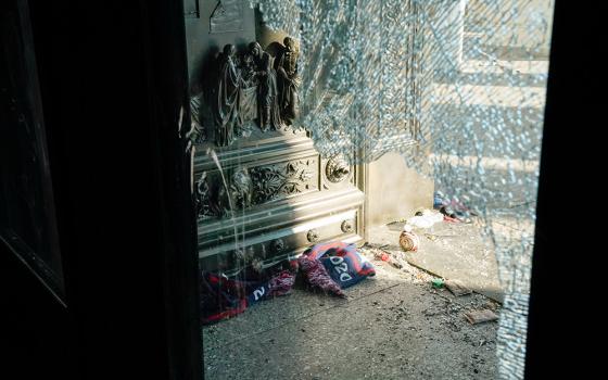 Debris is seen through a smashed glass door Jan. 7 at the U.S. Capitol in Washington, D.C., one day after supporters of President Donald Trump stormed Capitol Hill. (CNS/Reuters/Erin Scott)