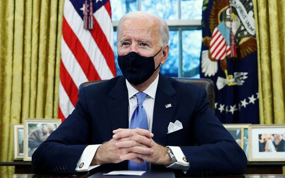 President Joe Biden at the White House in Washington Jan. 20, after his inauguration as the 46th president of the United States. At right (CNS/Reuters/Tom Brenner)