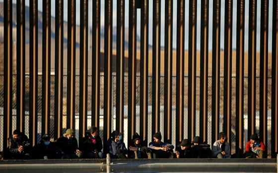 Migrants from Central America seeking asylum in the United States turn themselves in after crossing into El Paso, Texas, Jan. 22. (CNS/Reuters/Jose Luis Gonzalez)